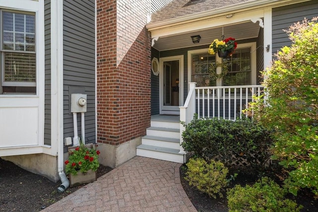 1 Liberty Ln, North Reading, MA 01864 - property entrance featuring brick siding and a porch