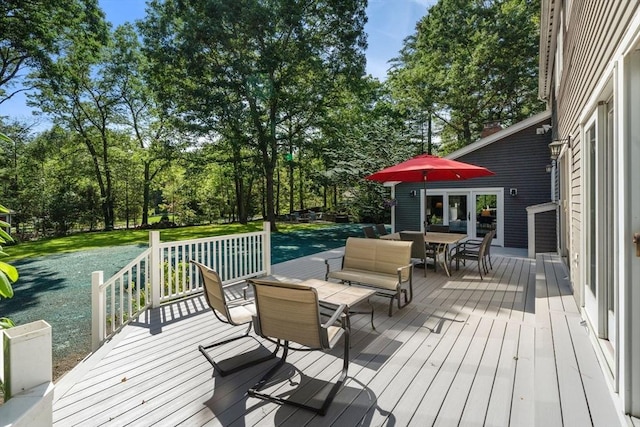 1 Liberty Ln, North Reading, MA 01864 - deck with outdoor dining space, view of scattered trees, and a lawn