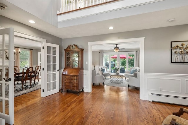 1 Liberty Ln, North Reading, MA 01864 - entryway with baseboard heating, french doors, plenty of natural light, wood finished floors, and a wainscoted wall