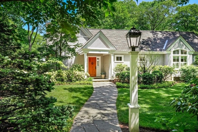 view of front of property with a front lawn