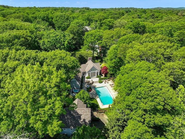 aerial view featuring a wooded view