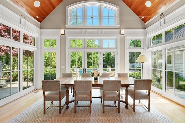 sunroom featuring wood ceiling and vaulted ceiling