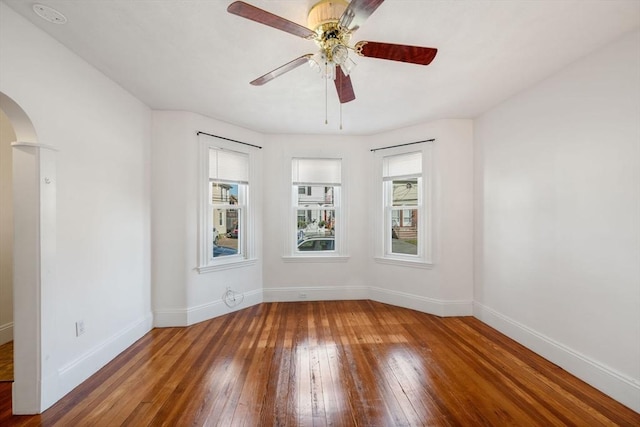 unfurnished room with wood-type flooring and ceiling fan