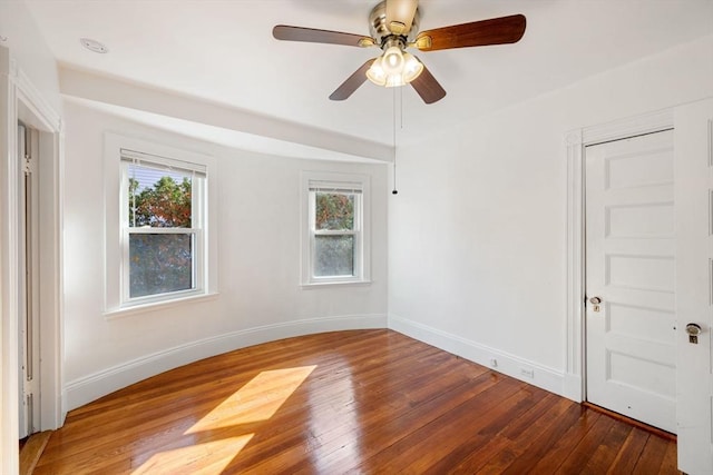 unfurnished room featuring hardwood / wood-style floors and ceiling fan