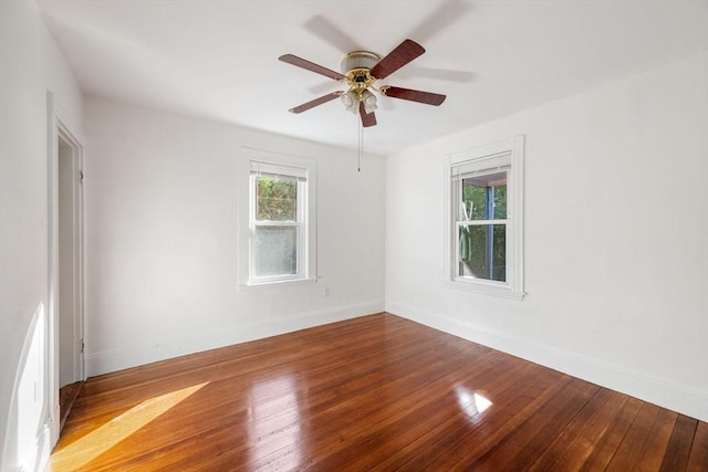 empty room featuring hardwood / wood-style flooring and ceiling fan