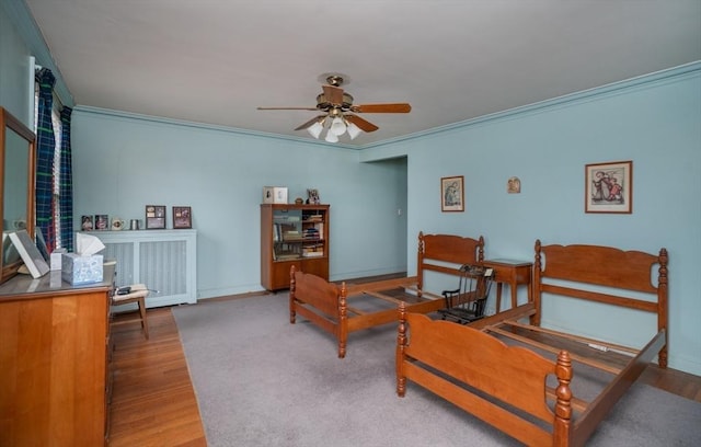 interior space featuring crown molding, baseboards, and wood finished floors