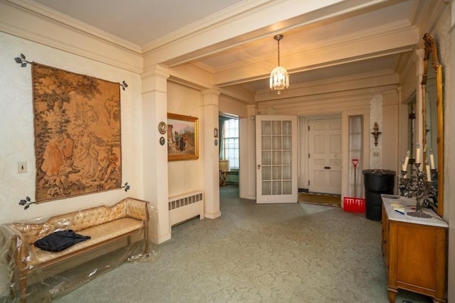 mudroom featuring radiator and ornamental molding