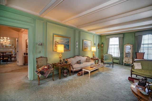 living area featuring beamed ceiling, ornamental molding, and carpet floors