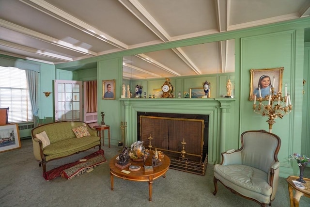 living area with carpet, a fireplace, and radiator heating unit