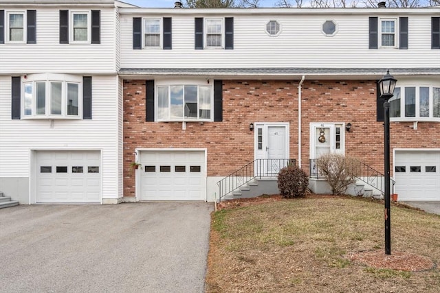 47 Plantation Rd Unit 47, Oxford, MA 01540 - multi unit property featuring brick siding, driveway, and an attached garage