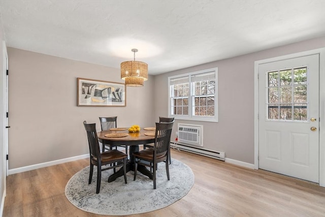 47 Plantation Rd Unit 47, Oxford, MA 01540 - dining area with light wood finished floors, baseboards, baseboard heating, and a wall mounted AC