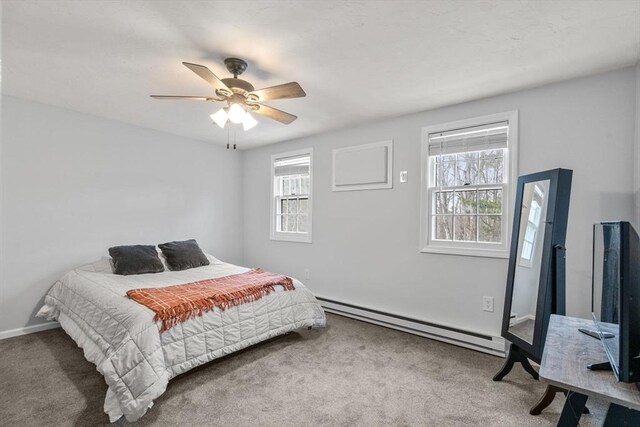 47 Plantation Rd Unit 47, Oxford, MA 01540 - carpeted bedroom with a baseboard heating unit, multiple windows, and a ceiling fan