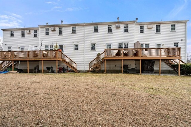 47 Plantation Rd Unit 47, Oxford, MA 01540 - rear view of property with a lawn, stairs, and a wooden deck