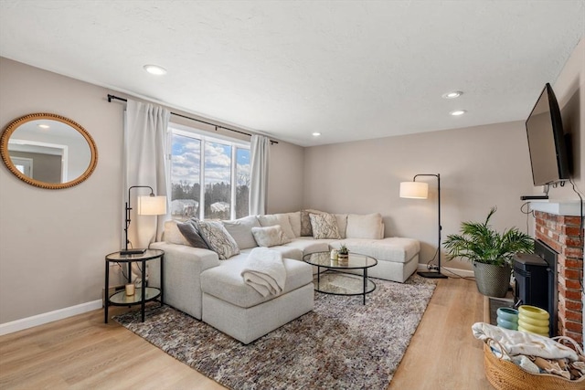 47 Plantation Rd Unit 47, Oxford, MA 01540 - living area featuring a brick fireplace, baseboards, light wood finished floors, and recessed lighting