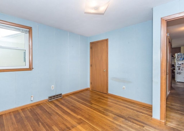 177 Pine Hill Cir, Waltham, MA 02451 - unfurnished room with wood finished floors and baseboards