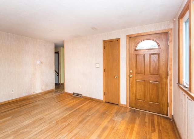177 Pine Hill Cir, Waltham, MA 02451 - foyer entrance with wood finished floors and baseboards