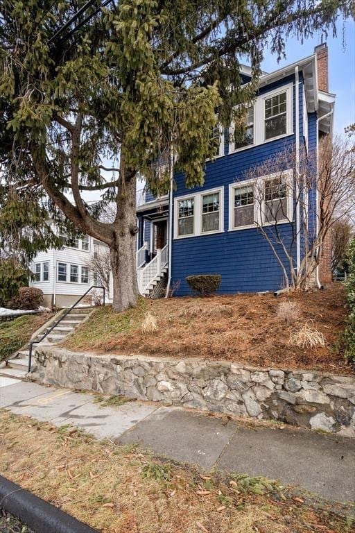 view of front of home featuring a chimney