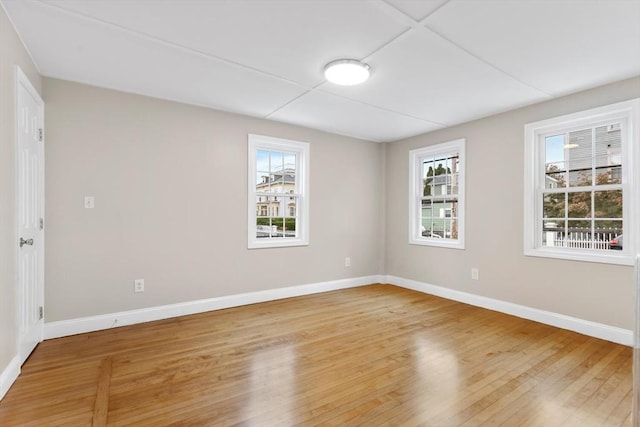 unfurnished room featuring wood-type flooring