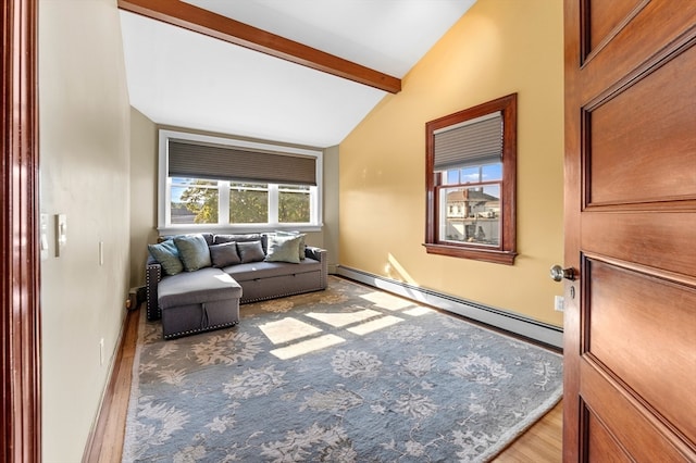 living room with a baseboard radiator, vaulted ceiling with beams, light hardwood / wood-style floors, and plenty of natural light