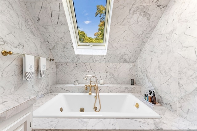 bathroom featuring tiled tub and tile walls