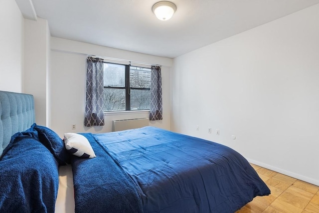 bedroom featuring baseboards