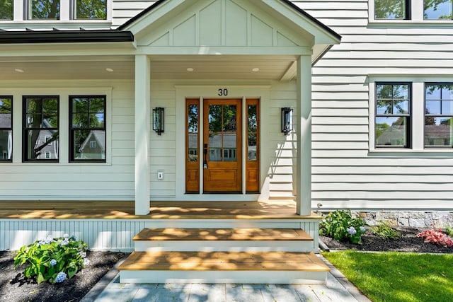 30 Alberta Ave, Newburyport, MA 01950 - doorway to property featuring covered porch and board and batten siding