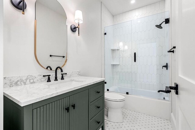 30 Alberta Ave, Newburyport, MA 01950 - full bathroom with vanity, toilet, bath / shower combo with glass door, and tile patterned flooring