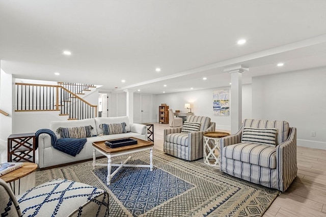 30 Alberta Ave, Newburyport, MA 01950 - living room with stairway, light wood-style floors, recessed lighting, ornate columns, and baseboards