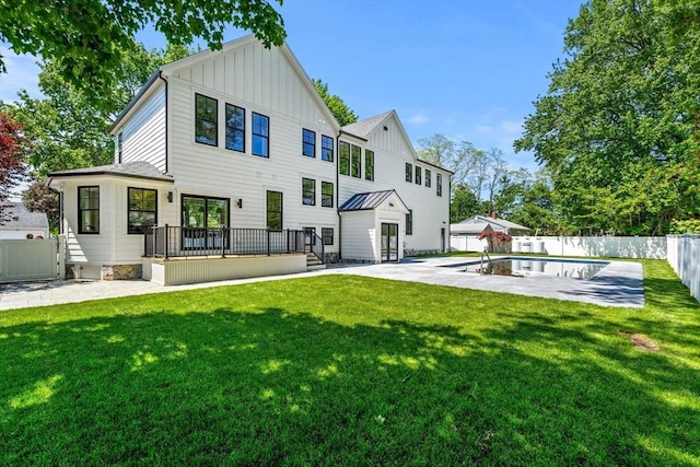 30 Alberta Ave, Newburyport, MA 01950 - rear view of house featuring board and batten siding, a wooden deck, and a patio area