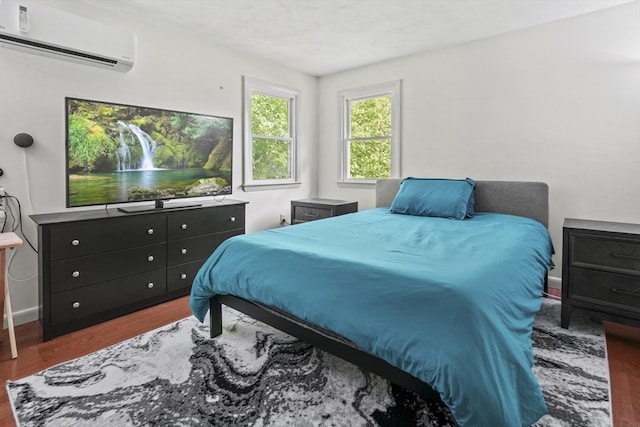 24 Highland Ave, Millbury, MA 01527 - bedroom with a wall mounted AC and wood finished floors