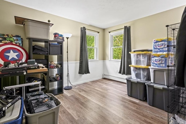 24 Highland Ave, Millbury, MA 01527 - office area featuring a baseboard heating unit, wood finished floors, and a wainscoted wall