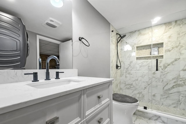 24 Highland Ave, Millbury, MA 01527 - bathroom with marble look tile flooring, a stall shower, vanity, and toilet