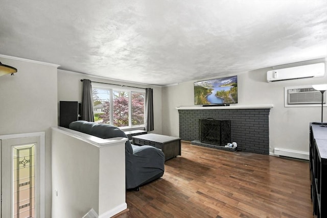 24 Highland Ave, Millbury, MA 01527 - living room featuring a wall unit AC, a baseboard radiator, wood finished floors, an AC wall unit, and a fireplace