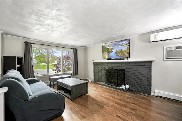 24 Highland Ave, Millbury, MA 01527 - living room featuring a wall unit AC, a brick fireplace, wood finished floors, baseboards, and crown molding