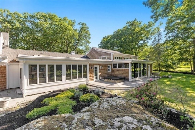 8 Evergreen Ln, Hingham, MA 02043 - rear view of house featuring a sunroom, a jacuzzi, a wooden deck, roof with shingles, and a yard
