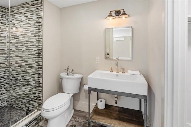 8 Evergreen Ln, Hingham, MA 02043 - bathroom featuring toilet, a shower stall, baseboards, wood finished floors, and a sink