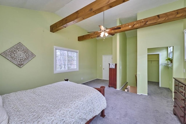 55 Friendship St, Billerica, MA 01821 - bedroom with vaulted ceiling with beams, a spacious closet, a ceiling fan, a closet, and carpet floors