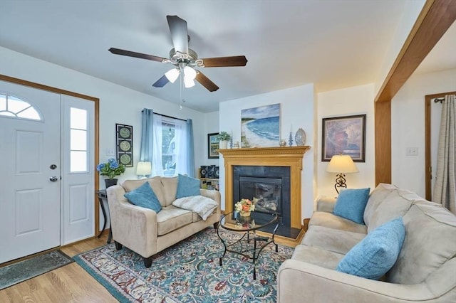 55 Friendship St, Billerica, MA 01821 - living area with a glass covered fireplace, a ceiling fan, and wood finished floors