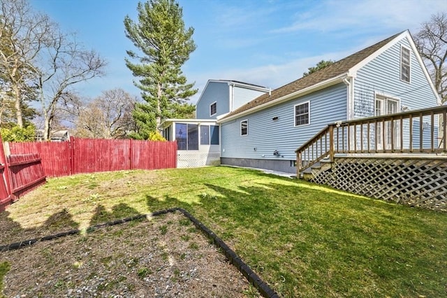 55 Friendship St, Billerica, MA 01821 - view of yard with a wooden deck, fence, and a sunroom