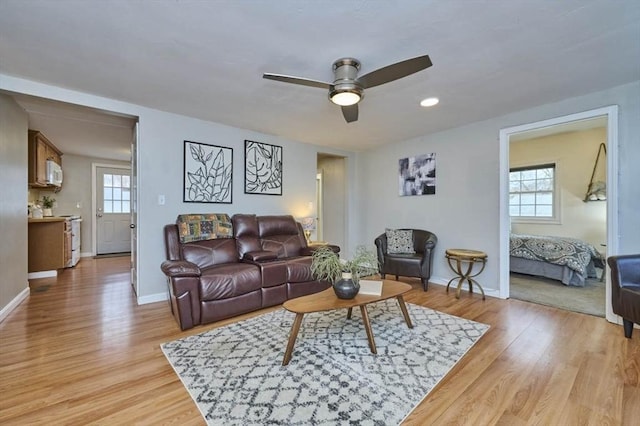 55 Friendship St, Billerica, MA 01821 - living area featuring a wealth of natural light, light wood finished floors, baseboards, and ceiling fan