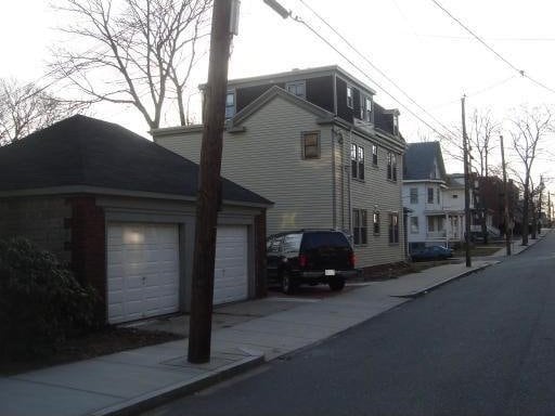 33 Franklin St, Chelsea, MA 02150 - view of side of property featuring driveway and a residential view
