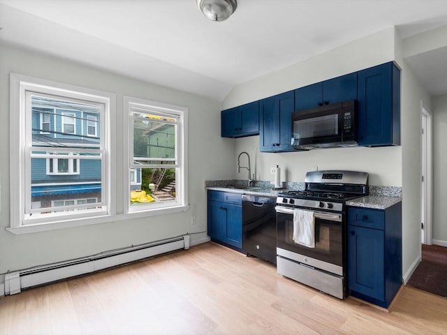 33 Franklin St, Chelsea, MA 02150 - kitchen with black appliances, blue cabinetry, a baseboard heating unit, a sink, and light wood-style flooring