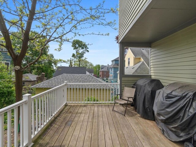 33 Franklin St, Chelsea, MA 02150 - wooden terrace with a grill and a residential view