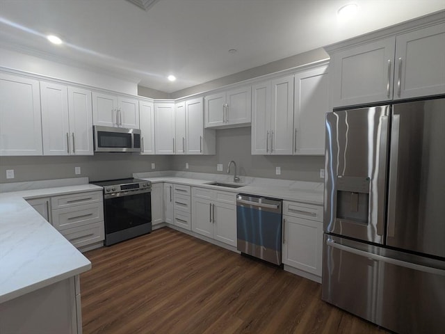 13 Nahant St Unit 2B, Lynn, MA 01902 - kitchen with stainless steel appliances, a sink, dark wood-type flooring, light stone countertops, and white cabinets