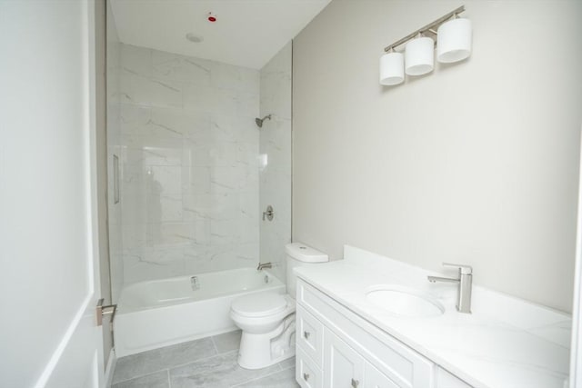 bathroom featuring washtub / shower combination, vanity, and toilet