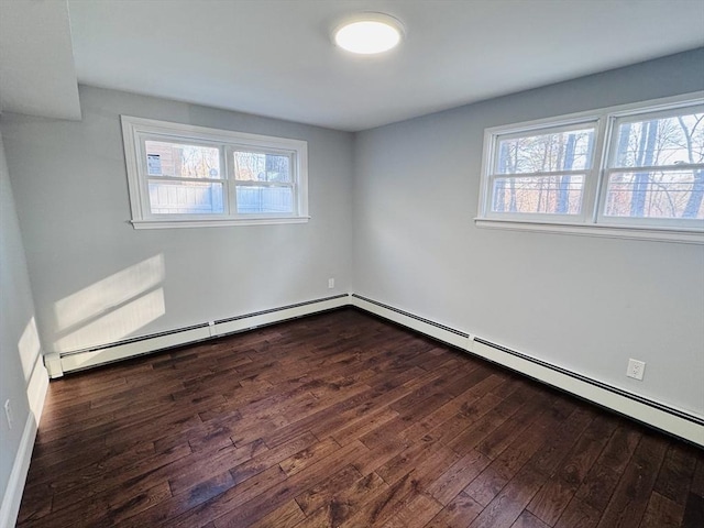 unfurnished room with dark wood finished floors