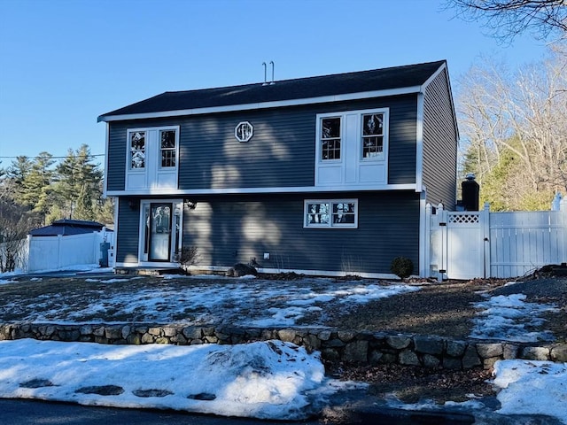 view of front of property featuring a gate and fence