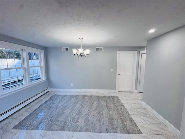 unfurnished room with a baseboard heating unit, marble finish floor, visible vents, and an inviting chandelier