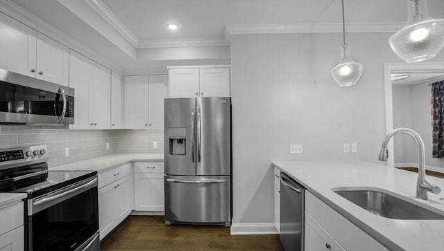 635 Old Post Rd Unit 204, Sharon, MA 02067 - kitchen with appliances with stainless steel finishes, dark wood-type flooring, crown molding, backsplash, and white cabinets