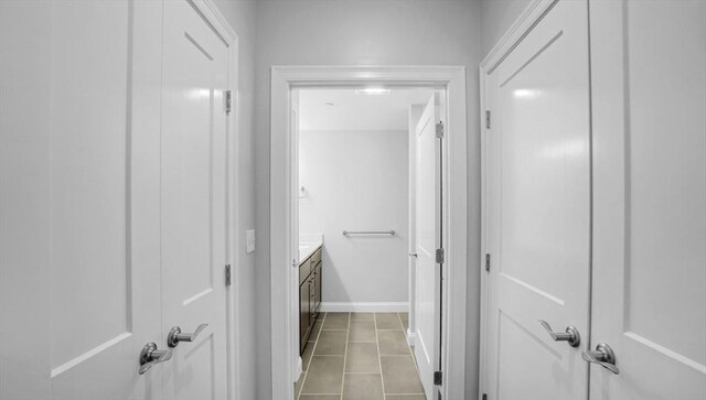 635 Old Post Rd Unit 204, Sharon, MA 02067 - hallway with tile patterned floors and baseboards